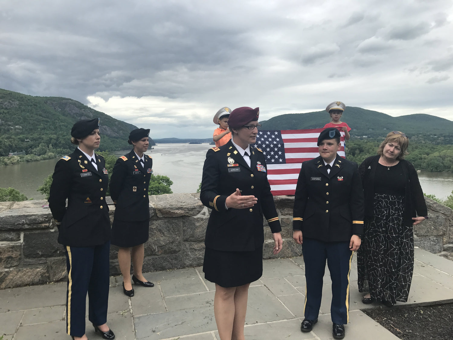 Army leader speaking in front of a group in uniform